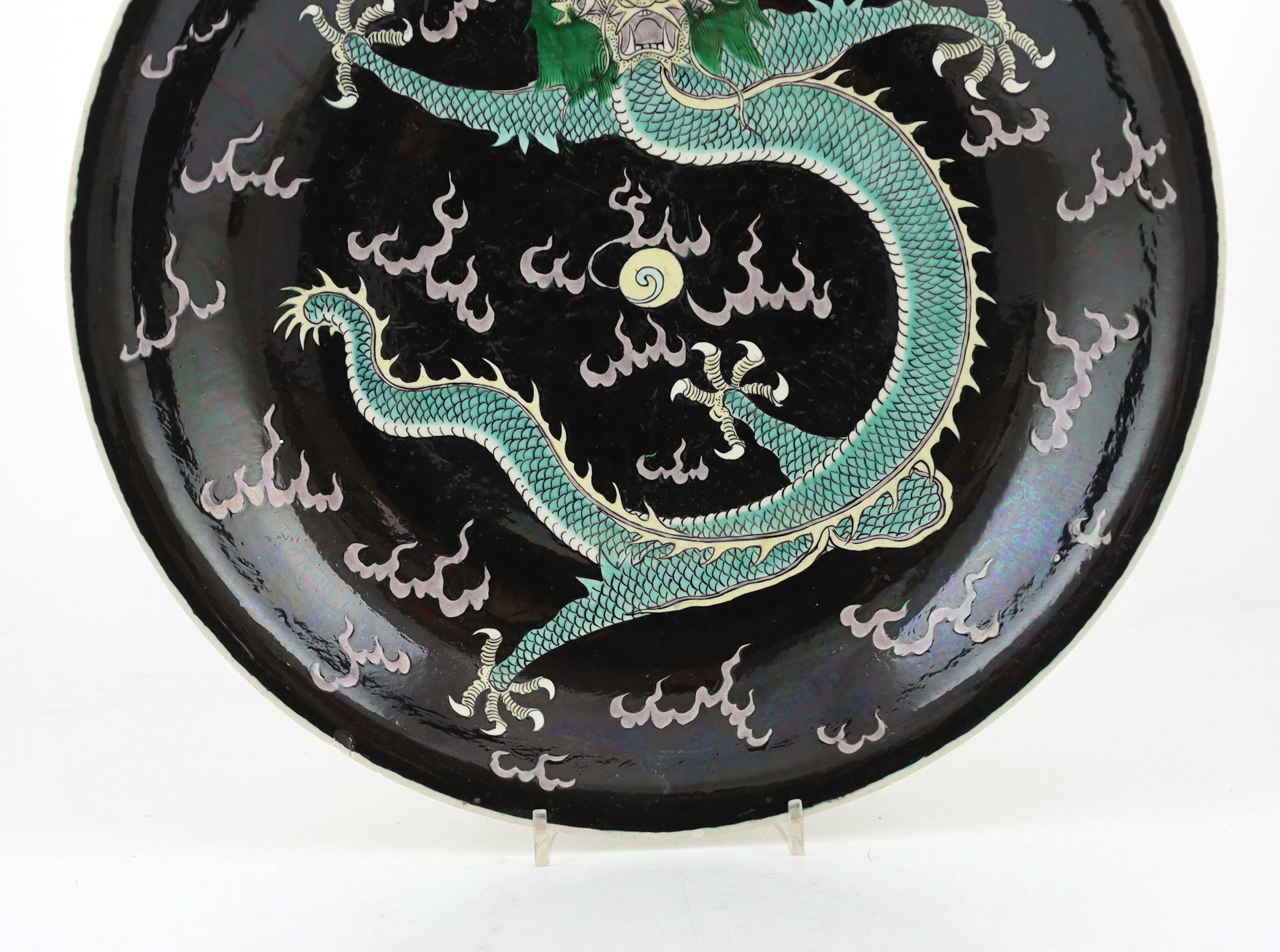 A Chinese enamelled porcelain 'dragon' dish, Kangxi mark but 19th century, small splinter rim chip, rim ground off